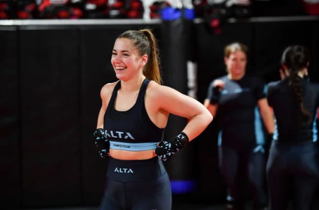 alta female competitor at mma training, hand wraps