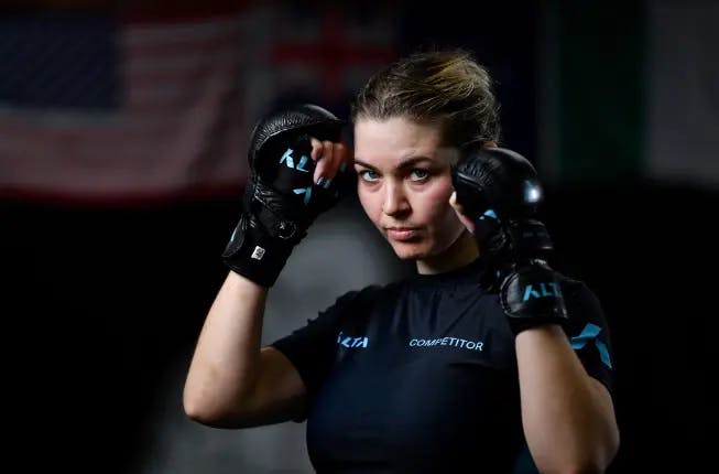 Female martial arts competitor training mma at alta gym 