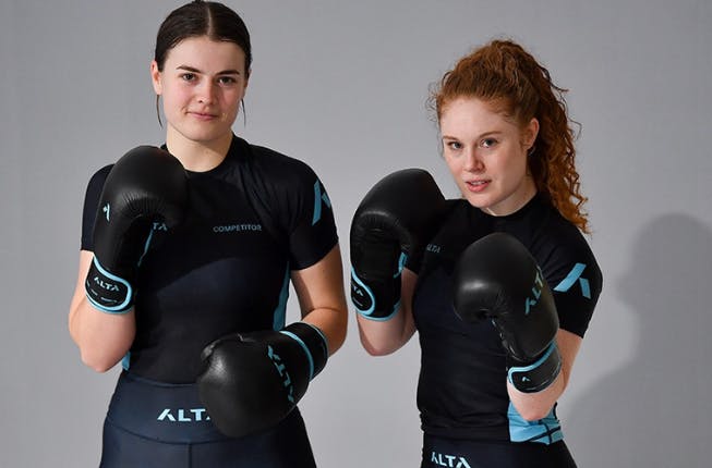 two women training with boxing gloves